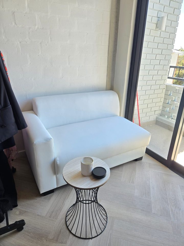 Sofa and side table by the balcony door